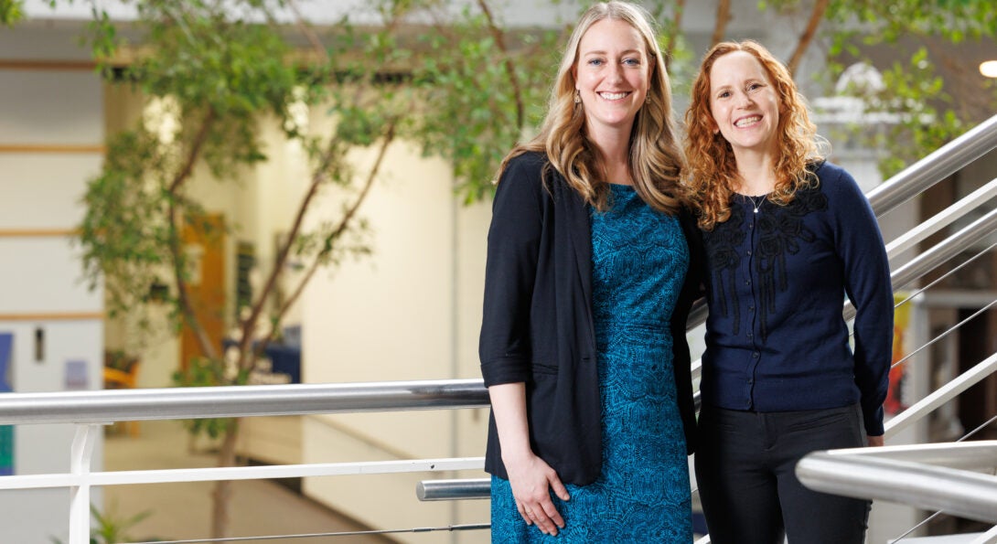 SLS Attorneys Sarah Baum and Lindsay Ditto standing in the Student Services Building.